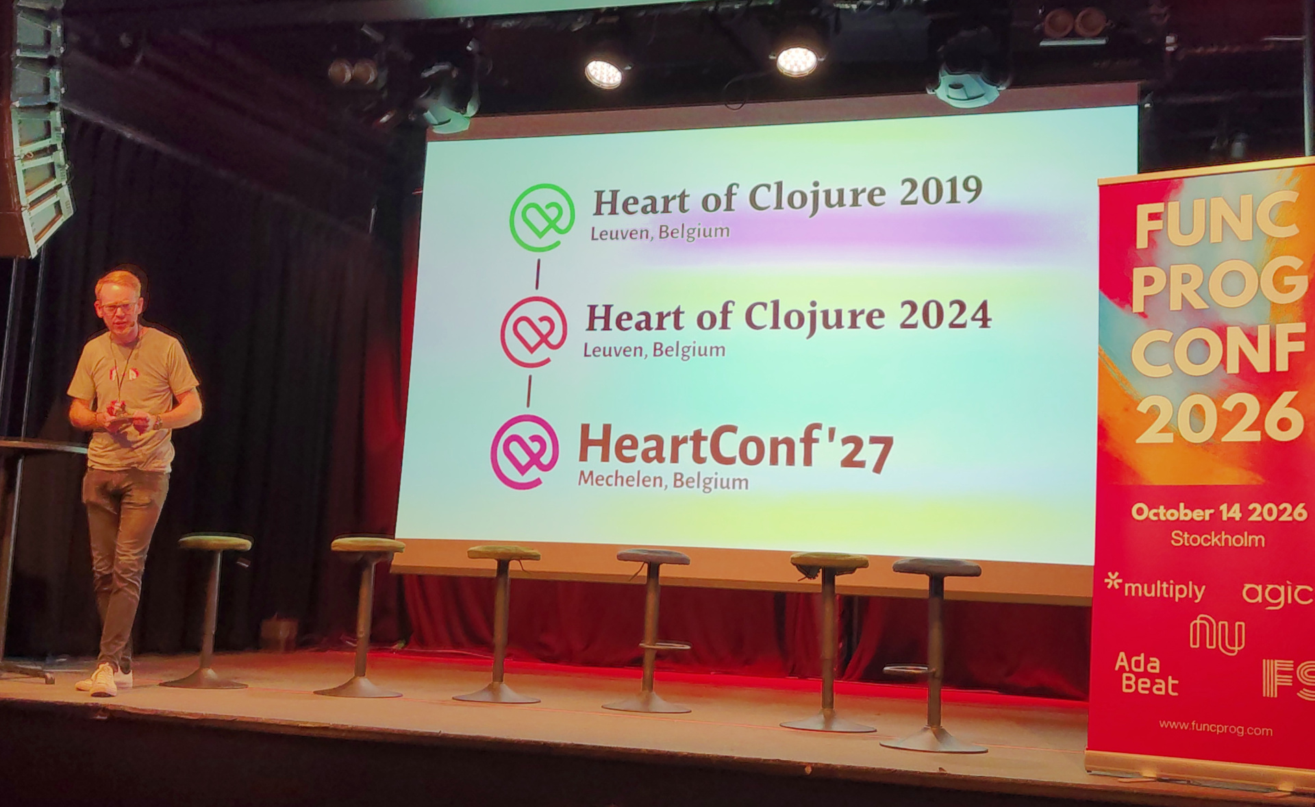 HeartConf is the heart of not just Clojure, but of humanity in programming Christoffer in front of a slide displaying the lineage of HeartConf