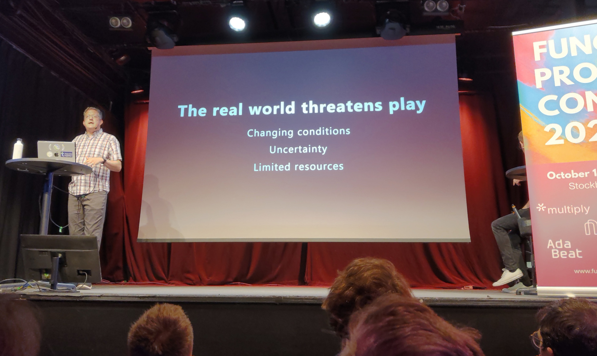 Snap back to reality, oh there goes gravity Christoph presents a slide labelled "The real world threatens play"